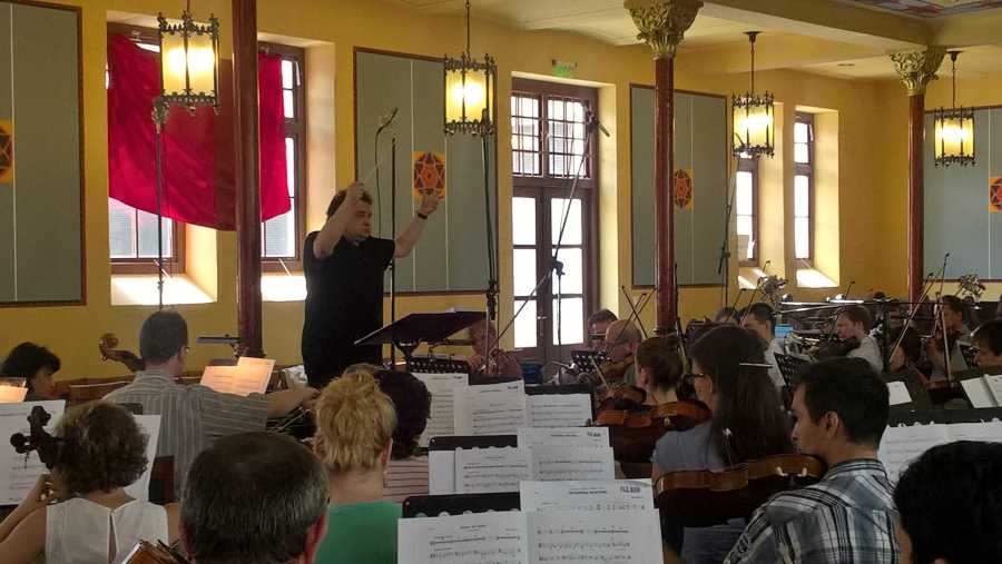 Paul Mann rehearsing the strings of the Kodály Philharmonic Orchestra for the first volume of pieces for Music For My Love.
